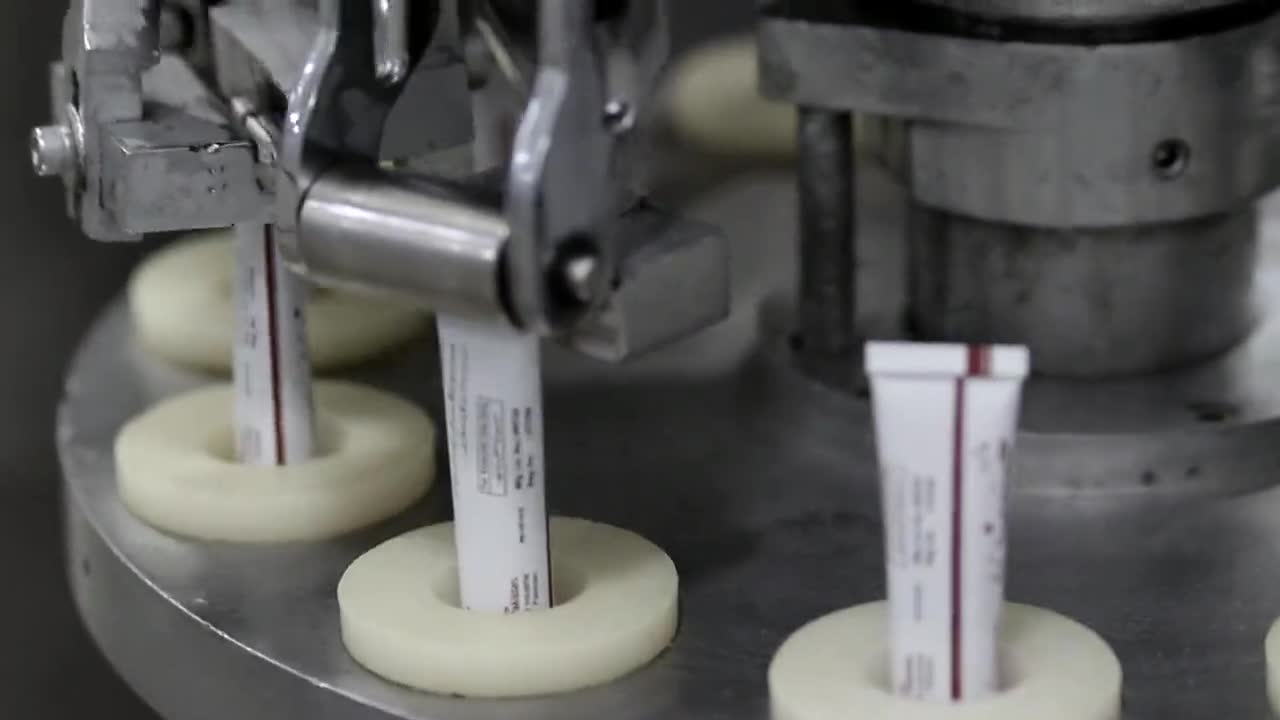 A pharmaceutical filling line, serialized units moving through it.